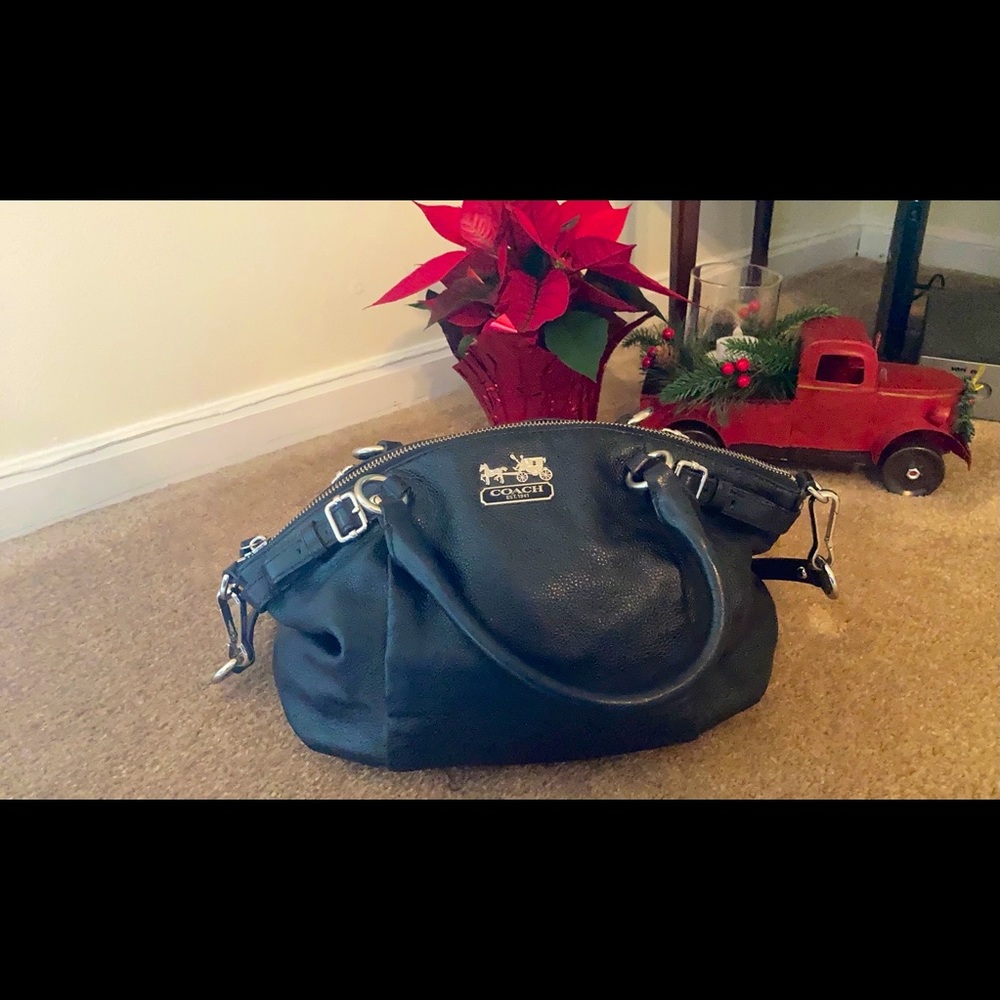 Black leather and silver emblem coach bag